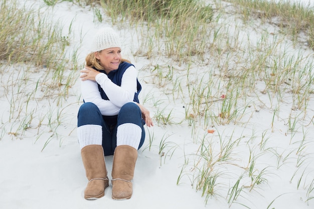 Senior woman looking away at beach