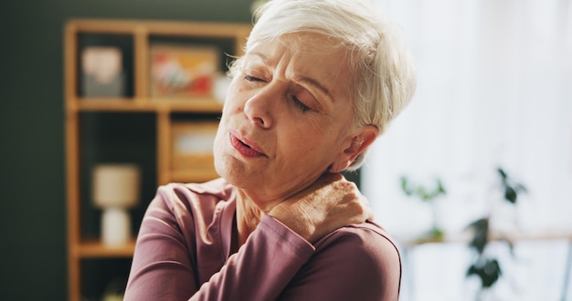 Senior woman neck pain and injury with shoulder in stress joint inflammation or muscle tension at home Elderly female person with sore spine bone or fibromyalgia in fatigue or discomfort at house
