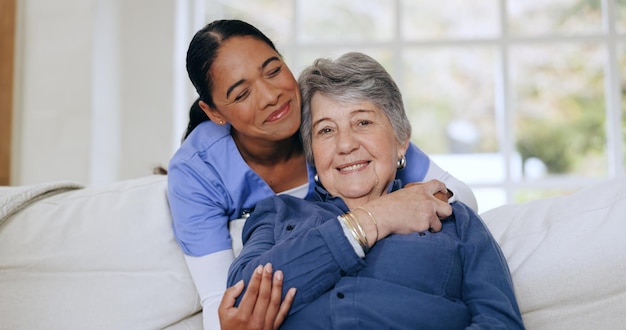 Photo senior woman nurse and hug on sofa retirement home and caregiver for support smiling and love friendly empathy and elderly for healthcare wellness and worker for patient respect and nursing