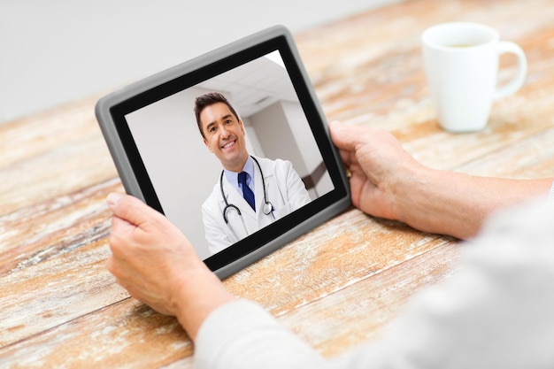 senior woman patient having video call with doctor