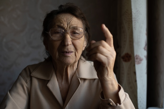 Senior woman pointing with finger