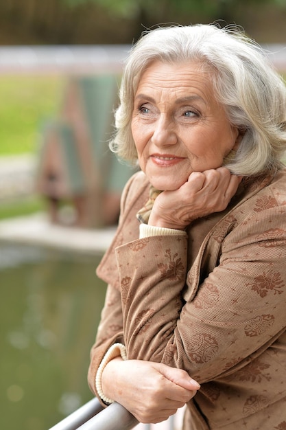 Senior woman posing in park