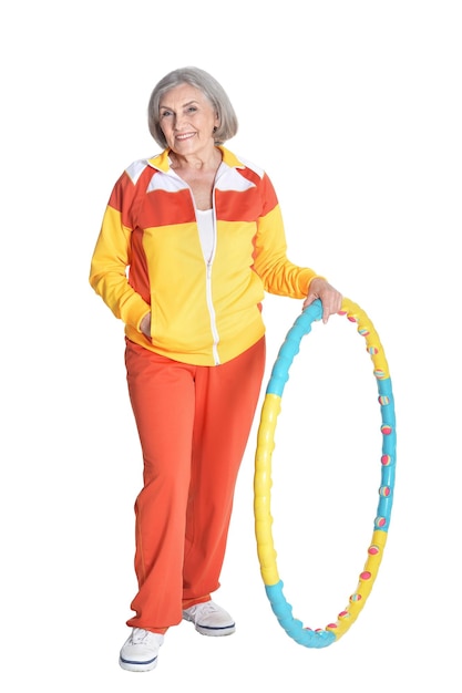 Senior woman posing with hoop isolated on white background