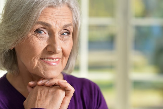 Senior woman in purple blouse