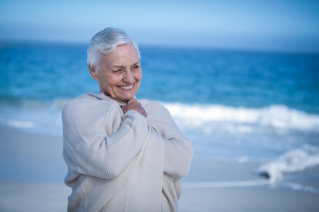 Senior woman relaxing at the beach