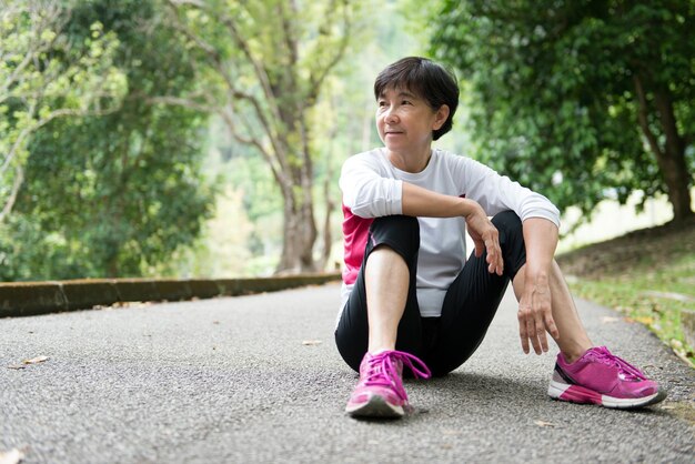 Senior woman resting after jogging