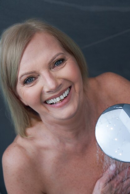 senior woman taking shower at home