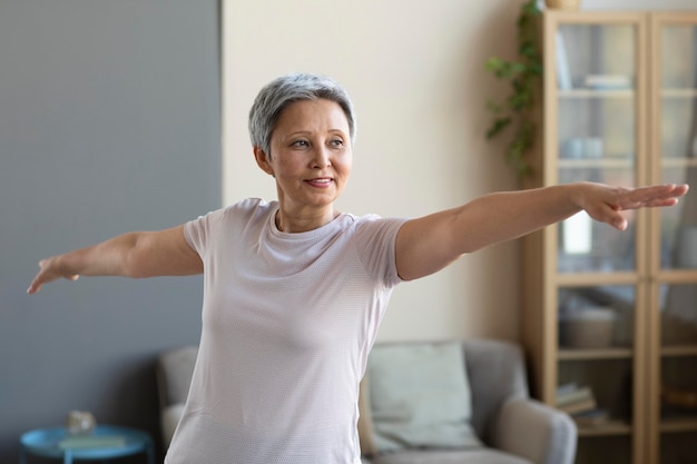 Senior woman training at home