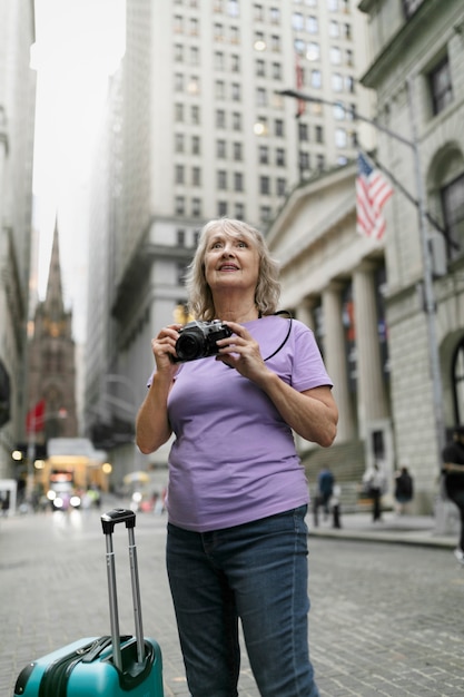 Senior woman traveling areound the world