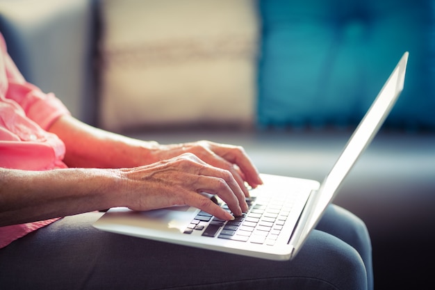 Senior woman using laptop