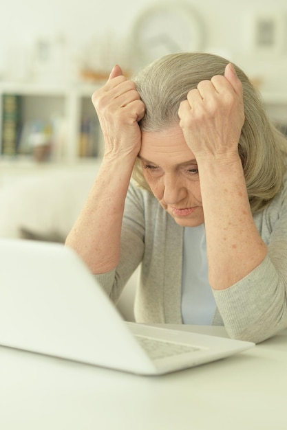 Senior woman using laptop