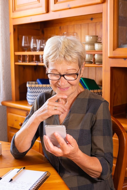 Senior woman using phone making video call