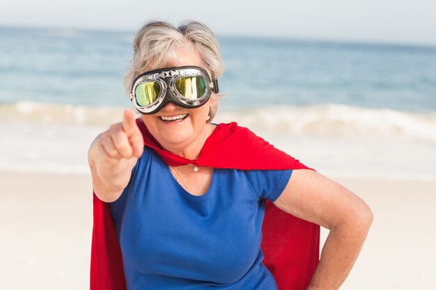 Senior woman wearing superwoman custome