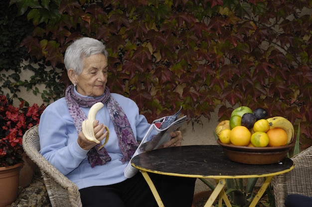 Senior  woman with a banana