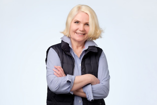 Senior woman with blonde hair looking confident