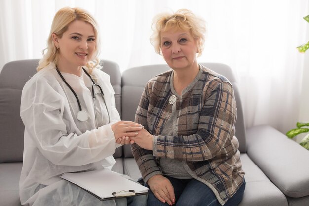 Senior woman with her home caregiver