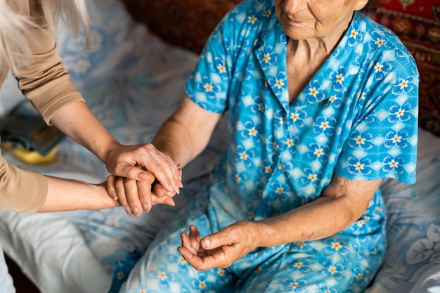 Senior woman with her home caregiver