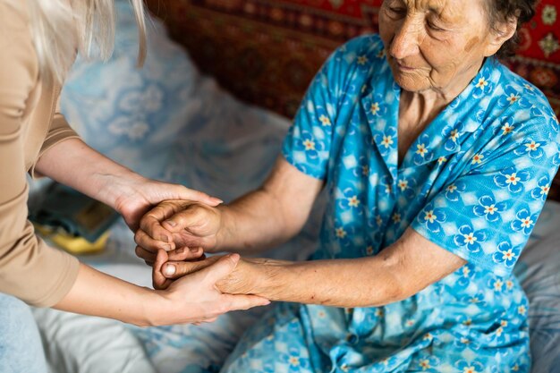 Senior woman with her home caregiver