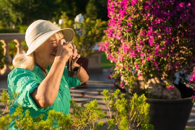 Senior woman with photo camera