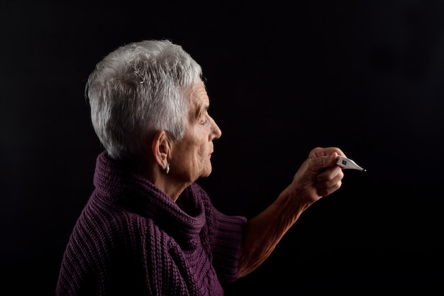 Senior woman with thermometer