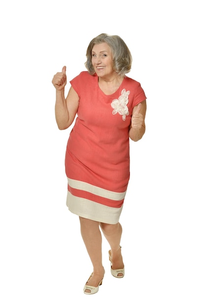 Senior woman with thumbs up isolated on white background