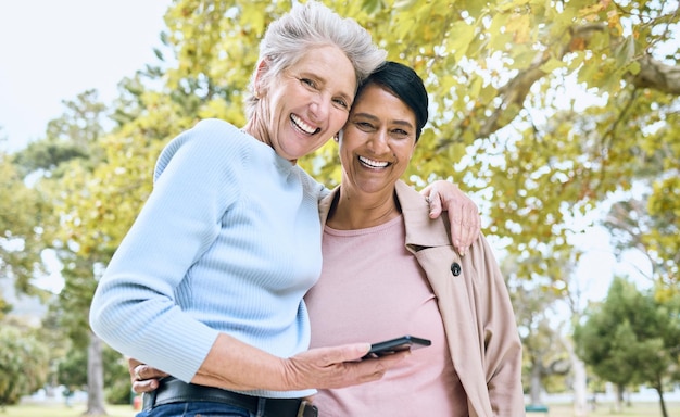 Photo senior women portrait hug or phone in nature park garden or relax environment for social media profile picture or memory smile happy friends or bonding retirement elderly on mobile technology