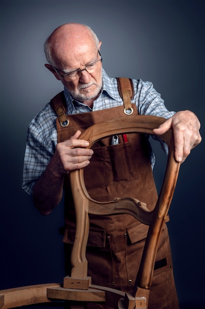 Senior woodworker at work