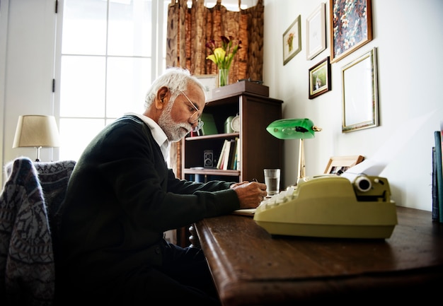 Seniore man writing