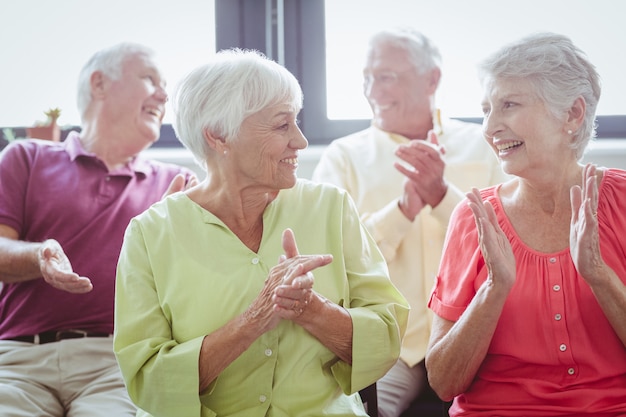 Seniors clapping hands