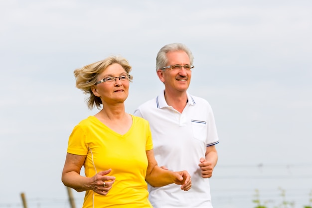 Seniors jogging in the nature doing sport