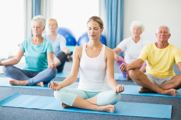 Seniors performing yoga