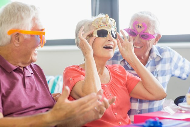 Seniors wearing funny glasses