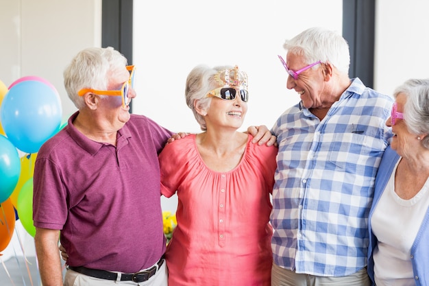 Photo seniors wearing funny glasses