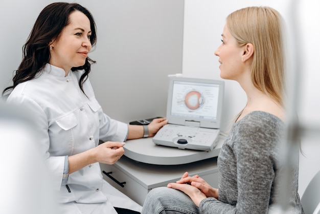 A sensitive, pleasant doctor tells the patient about the condition of the eyes.