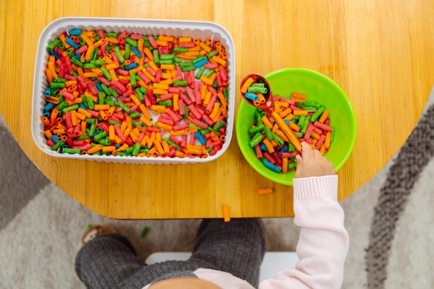 Sensory game sorting colored pasta