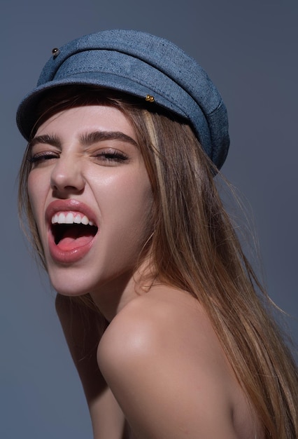 Sensual close up portrait of elegant young fashionable sexy woman in fashion cap hat beautiful girl