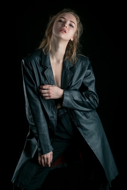 Sensual girl in black leather jacket. Clothing, style and fashion.