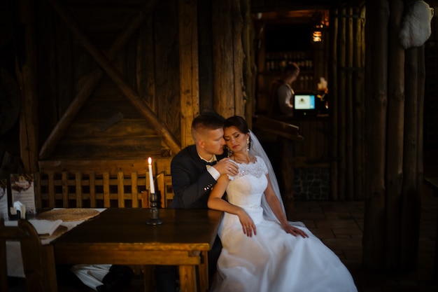 Sensual happy married couple in restaurant