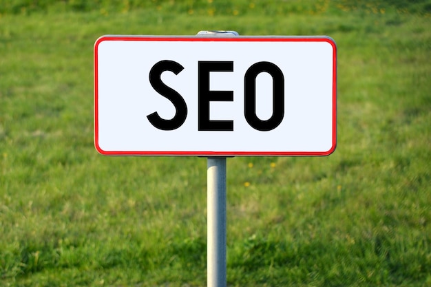 SEO white sign on a grass