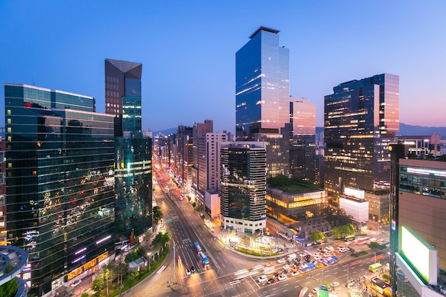 Seoul city Skyling and Skyscraper and Traffic at night intersection in Gangnam, South Korea.