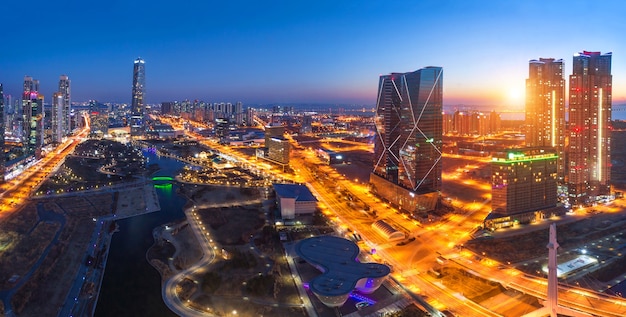 Seoul city with Beautiful after sunset and Skyscraper, Central park in Songdo District, Incheon South Korea.