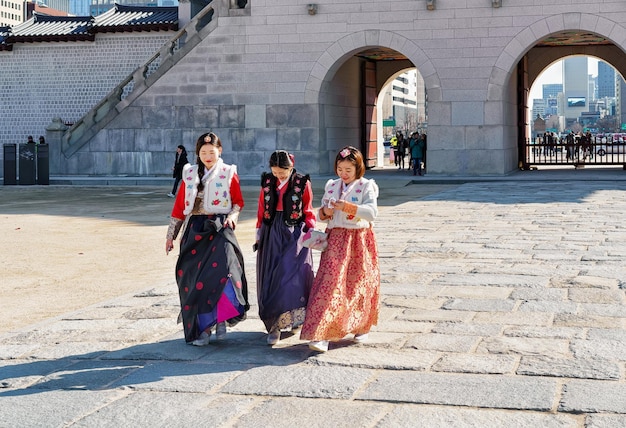 Seoul, South Korea - March 11, 2016: Young girls in traditional dresses at Gyeongbokgung Palace in Seoul, South Korea