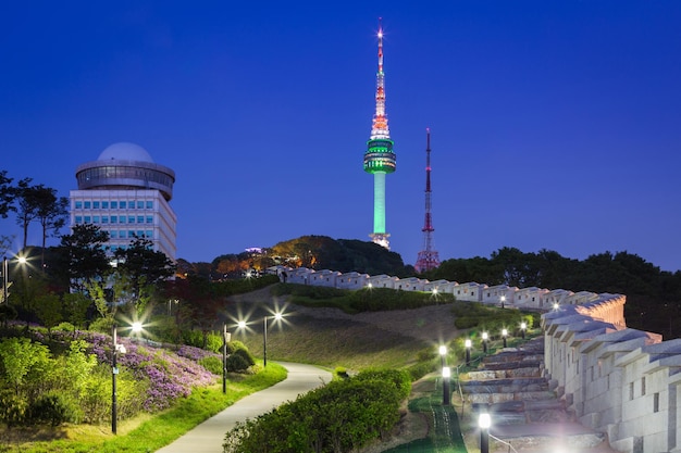 Seoul tower at night view and old wall with light south korea