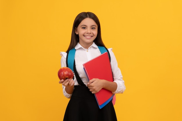 September 1 Happy girl hold apple and books School education September 1 Back to school