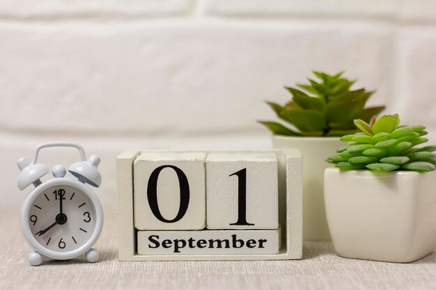 September 1 in a wooden calendar on a table or shelfBack to school Calendar for September Autumn