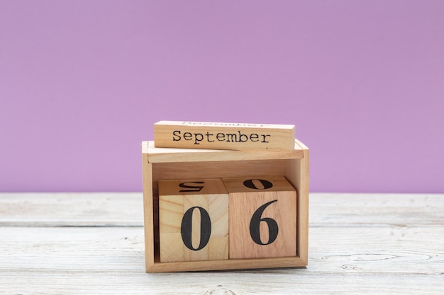 September 6. Image of September 6 wooden calendar on wooden table . Autumn day