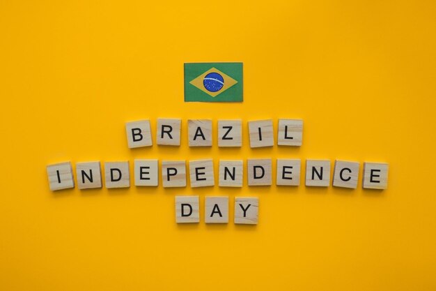 September 7 independence day of brasil flag of brazil minimalistic banner with wooden letters on an orange background