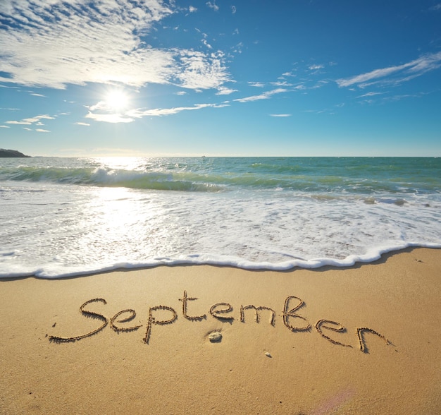 September word on sea sand Nature cpmposition