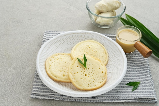 Serabi Durian Indonesian pancake made of rice flour and coconut milk served with durian sauce