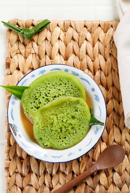 Serabi or Surabi Indonesian Traditional Pancake form Javanese Indonesia Made of Flour Rice Flour and Coconut Milk Served with Palm Sugar Sauce Top View